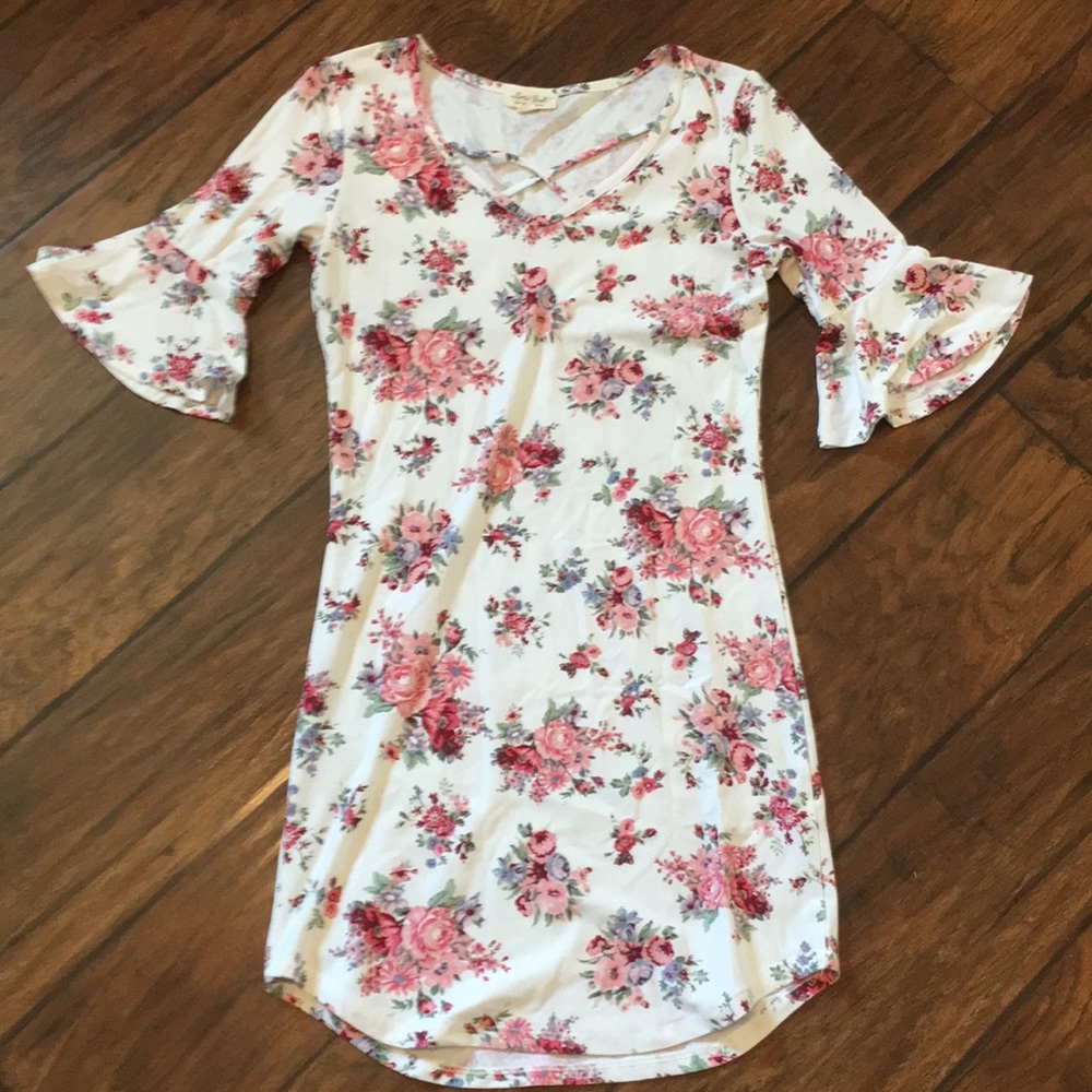 A floral mini dress with half-way flows sleeves